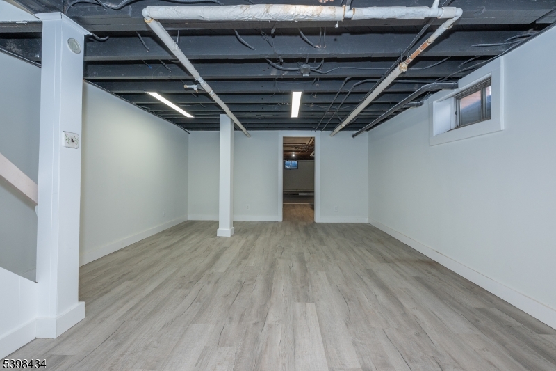 7 Oak Tree Lane Little Falls, NJ 07424 - Photo 33 of 46 a view of hallway with wooden floor