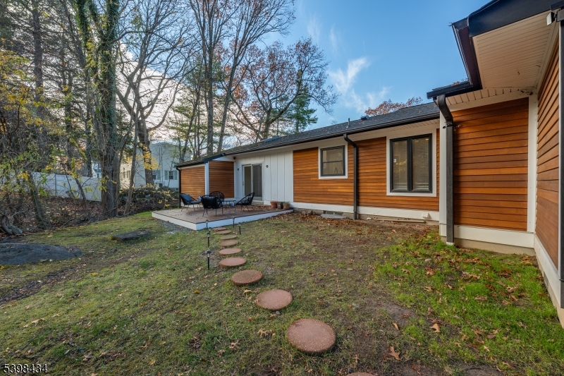 7 Oak Tree Lane Little Falls, NJ 07424 - Photo 40 of 46 a view of a backyard with a garden