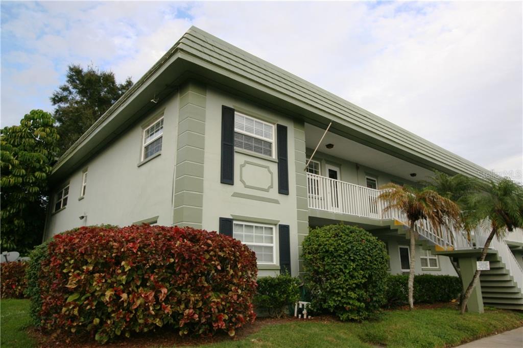 1433 South Belcher Road, Unit D10 Clearwater, FL 33764 - Photo 1 of 1 a backyard of a house with lots of green space
