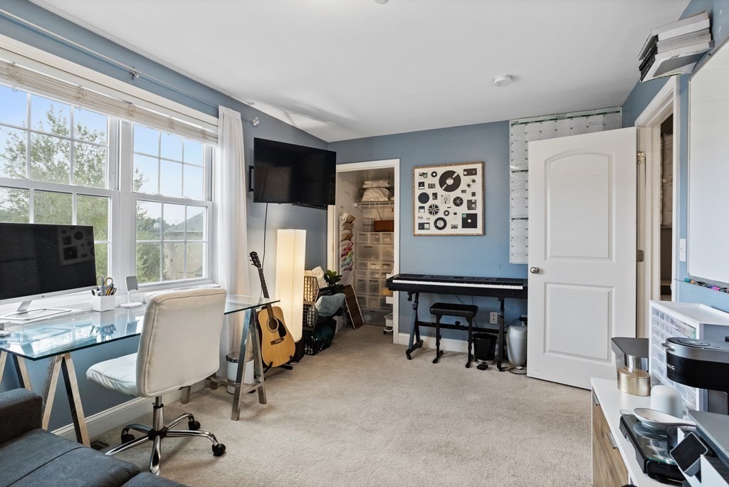 311 Littleton Road, Unit 20 Chelmsford, MA 01824 - Photo 25 of 35 a view of a livingroom with workspace and a window