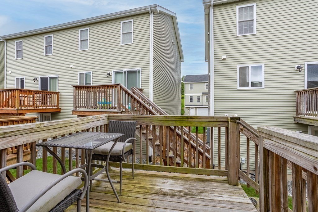 311 Littleton Road, Unit 20 Chelmsford, MA 01824 - Photo 28 of 35 a balcony with wooden floors and furniture