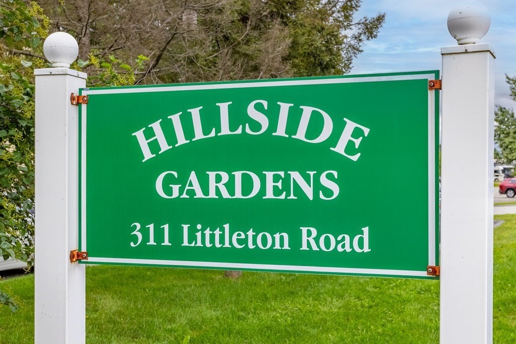 311 Littleton Road, Unit 20 Chelmsford, MA 01824 - Photo 34 of 35 a sign that is on the side of the building