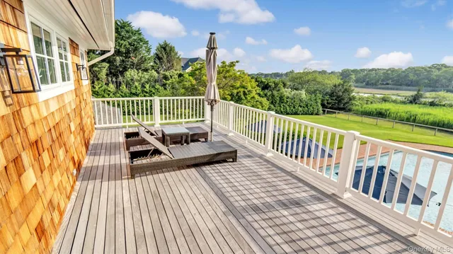 a view of a balcony with wooden floor