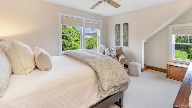 a bedroom with bed and window
