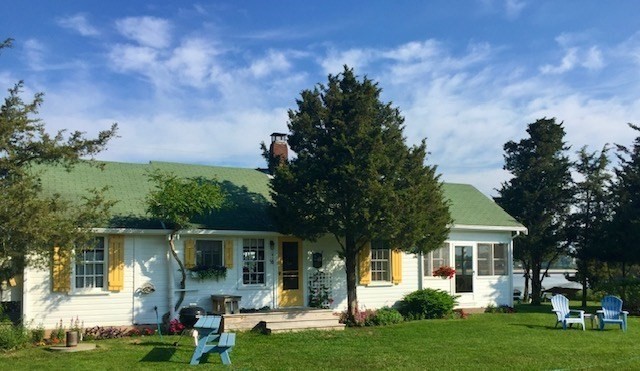 front view of a house with a yard