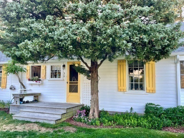 30 Lydias Island Road Wareham, MA 02571 - Photo 2 of 18 a front view of a house with garden
