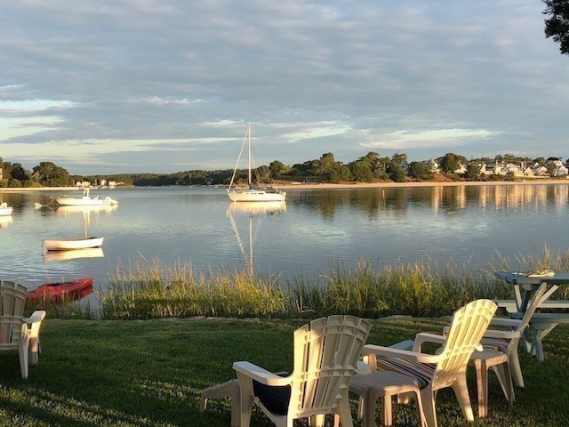 30 Lydias Island Road Wareham, MA 02571 - Photo 9 of 18 a view of a lake with couches and chairs