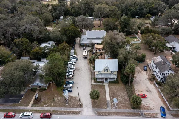 an aerial view of residential houses with outdoor space