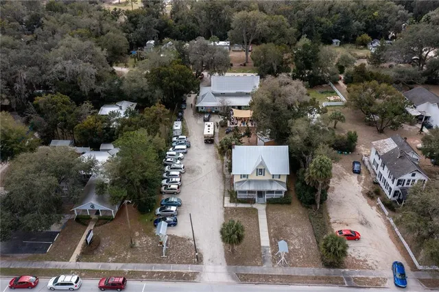 an aerial view of residential houses with outdoor space