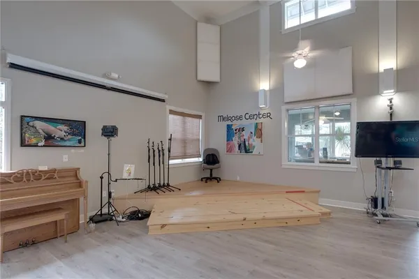 a view of a livingroom with furniture and a flat screen tv