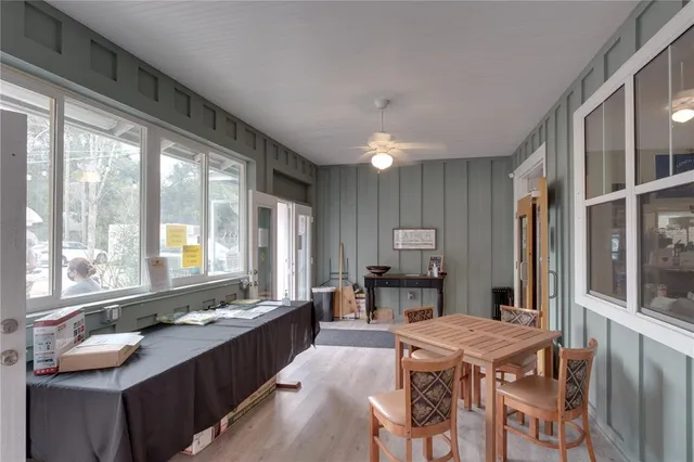 a large kitchen with a table and chairs