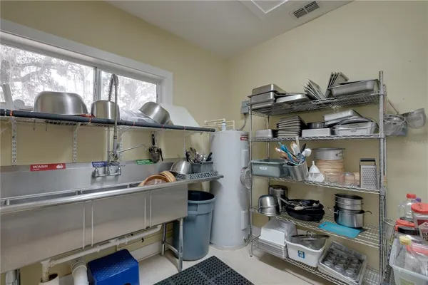 a room with a cabinets and a window