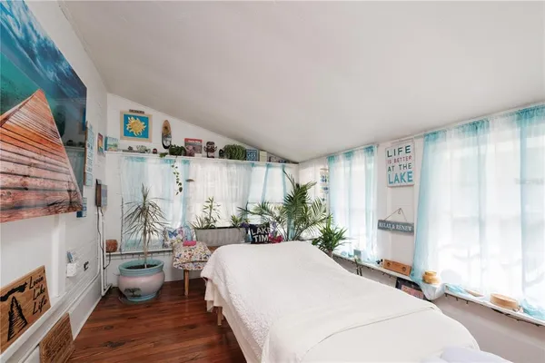 a bed room with a bed and a couch