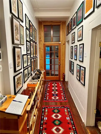a room with musical instruments and wooden floor