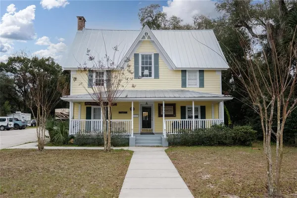 a front view of a house with yard