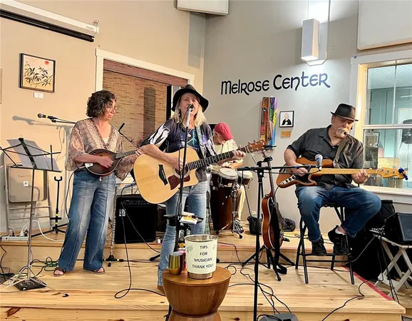 a group of people sitting outside of a house