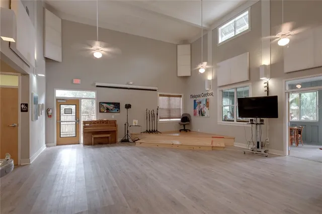 a view of a livingroom with furniture and a flat screen tv