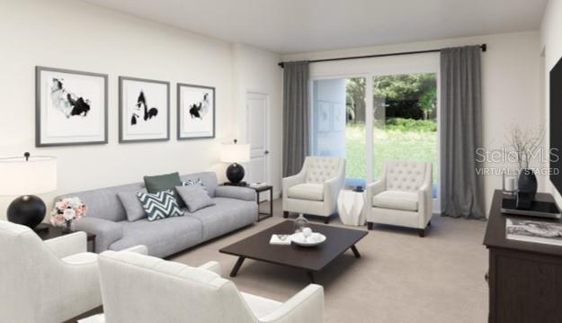 2455 Bluestone Road Haines City, FL 33844 - Photo 3 of 14 a living room with furniture and a large window