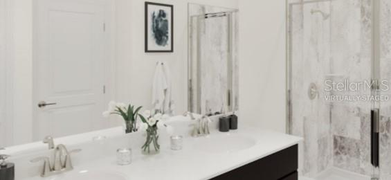 2455 Bluestone Road Haines City, FL 33844 - Photo 5 of 14 a bathroom with a sink and a mirror