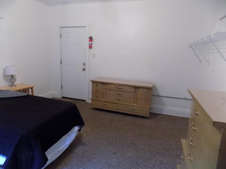 304 Helen Street McKees Rocks, PA 15136 - Photo 4 of 11 a bedroom with a bed and a cabinets