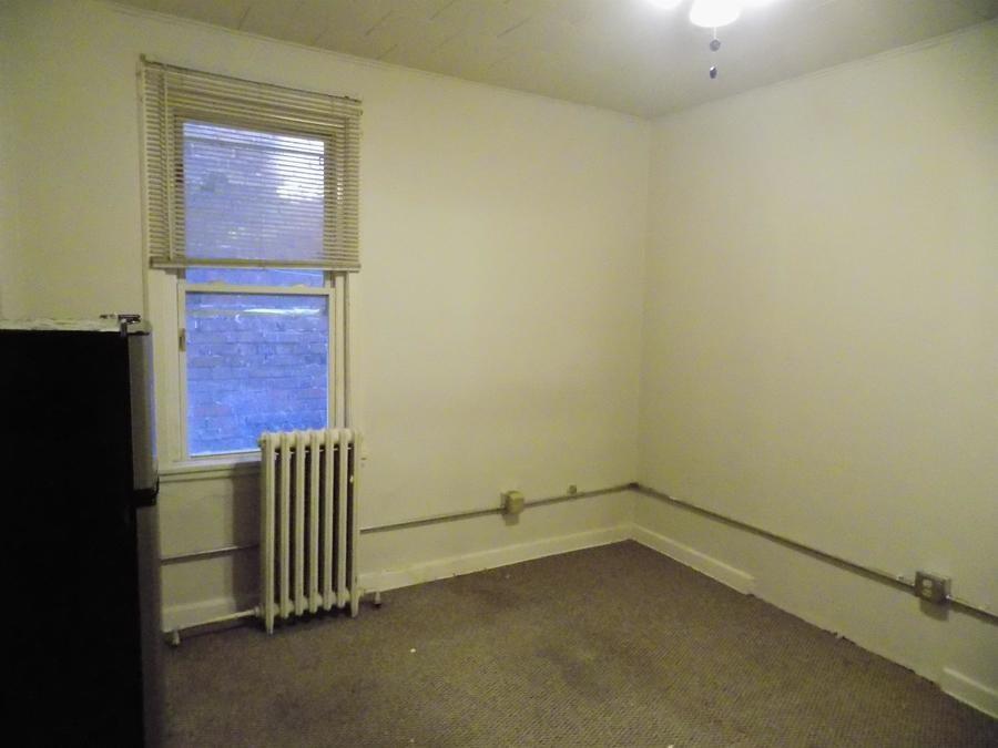 304 Helen Street McKees Rocks, PA 15136 - Photo 5 of 11 an empty room with a window