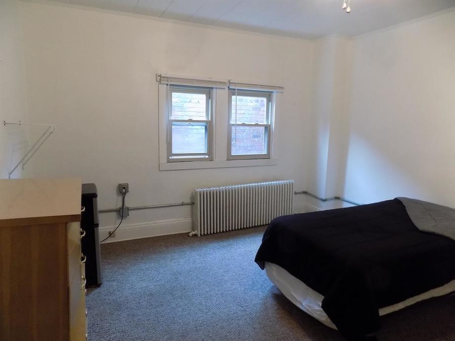304 Helen Street McKees Rocks, PA 15136 - Photo 7 of 11 a bedroom with a bed and a window