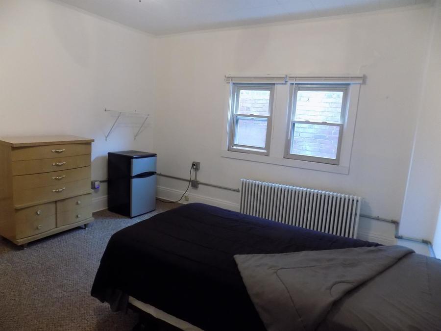 304 Helen Street McKees Rocks, PA 15136 - Photo 8 of 11 a bedroom with a bed and a window