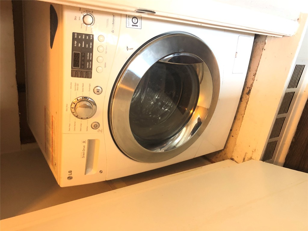 7302 Duval Street, Unit 141 Austin, TX 78752 - Photo 12 of 14 a utility room with dryer and washer