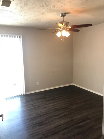 a view of a livingroom with wooden floor