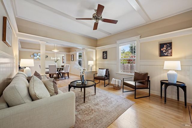a living room with furniture and a lamp