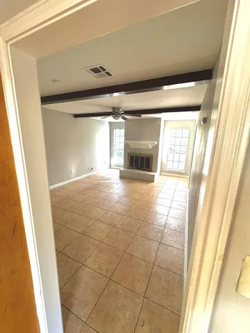 a view of an empty room and window