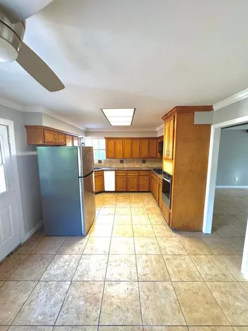 a bathroom with a tub shower and a sink