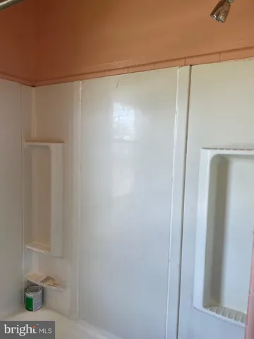 a view of a field of grass and trees