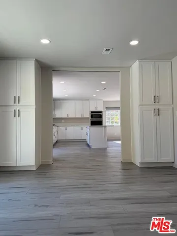 a view of kitchen with wooden floor