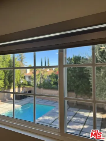 a view of a room with a large window