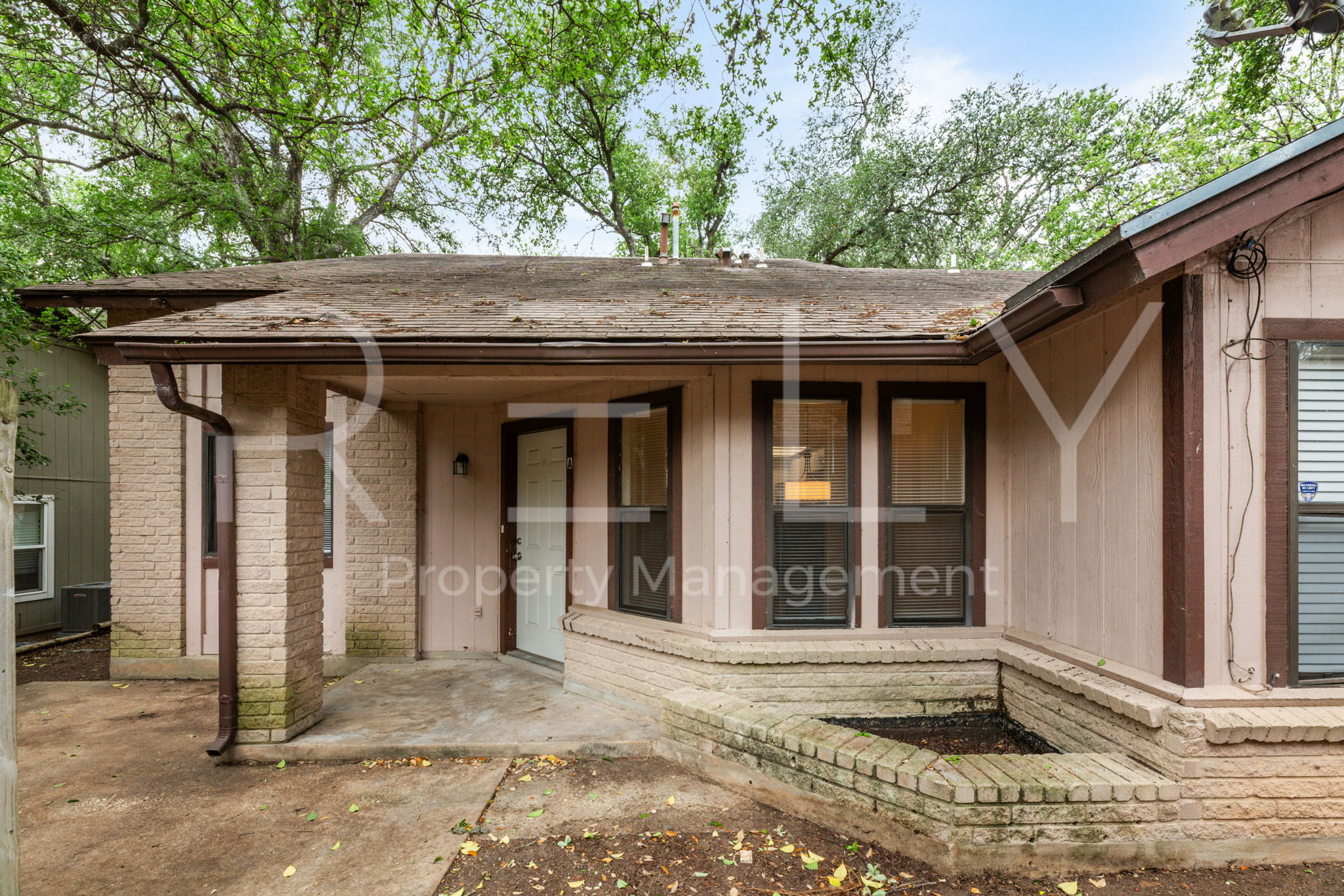 1005 Milford Way, Unit A Austin, TX 78745 - Photo 2 of 30 a view of a car door of the house