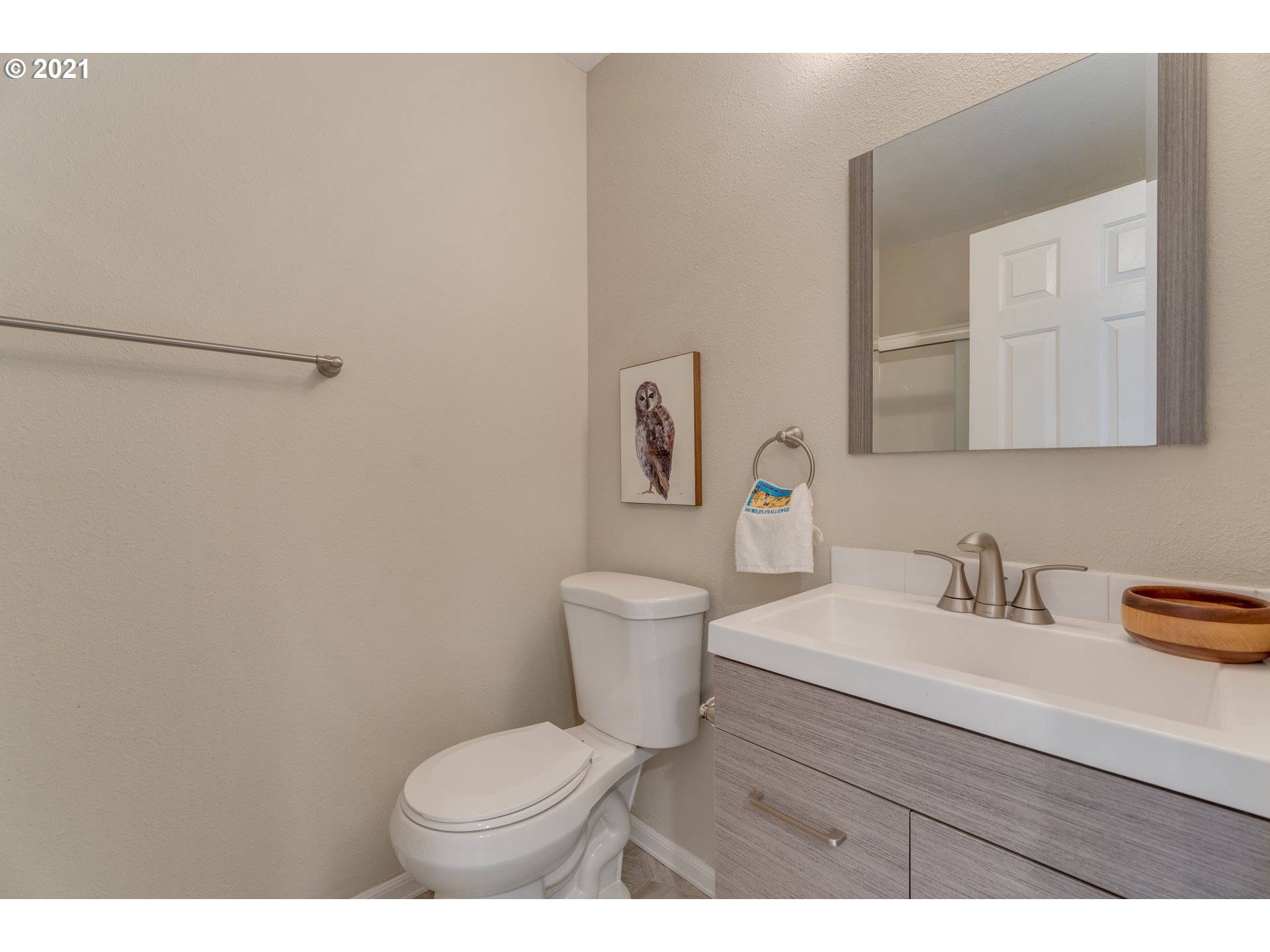 14134 East Burnside Street, Unit 4 Portland, OR 97233 - Photo 14 of 27 a bathroom with a sink toilet and a mirror