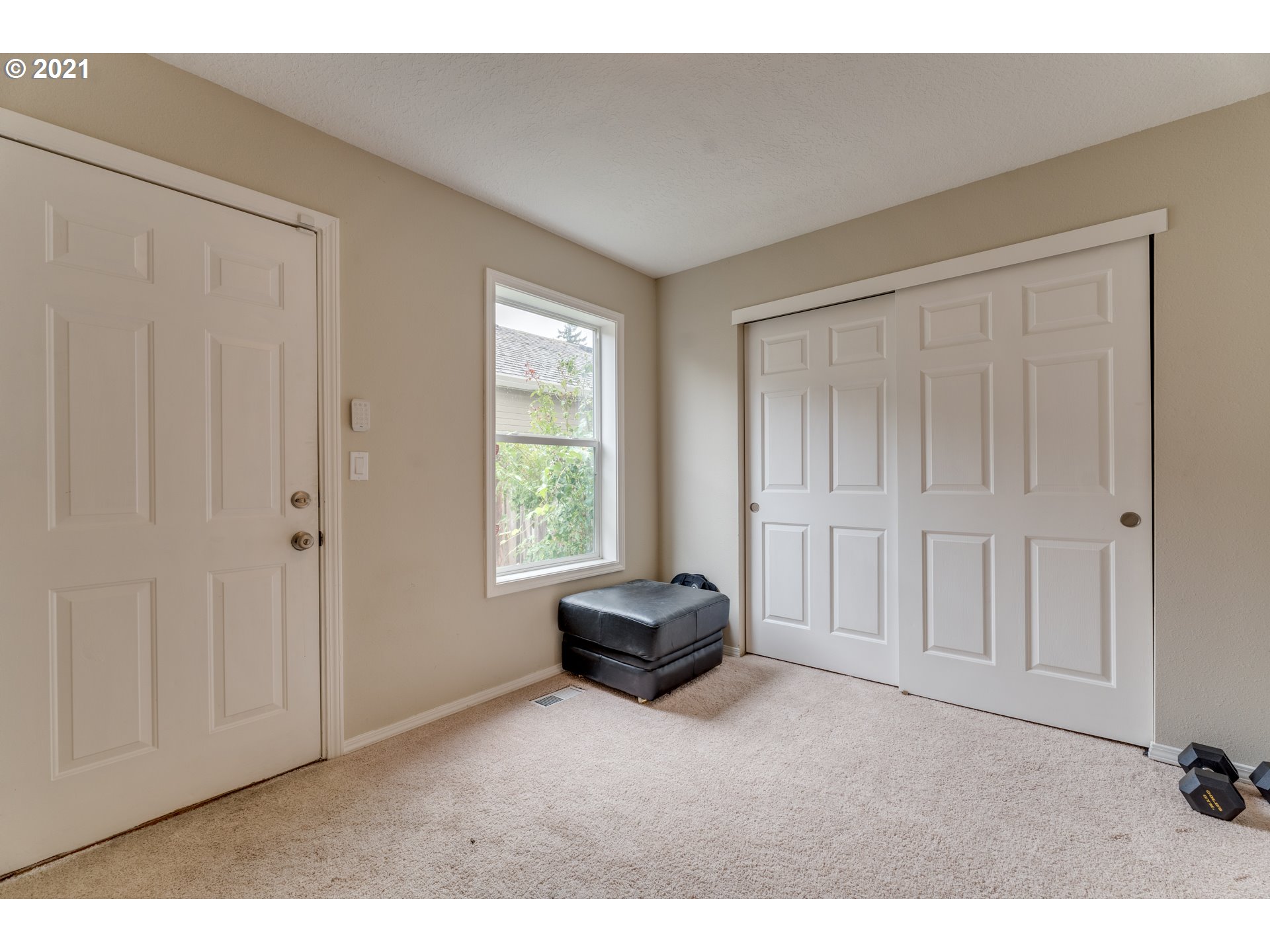 14134 East Burnside Street, Unit 4 Portland, OR 97233 - Photo 16 of 27 a living room with a furniture and a window
