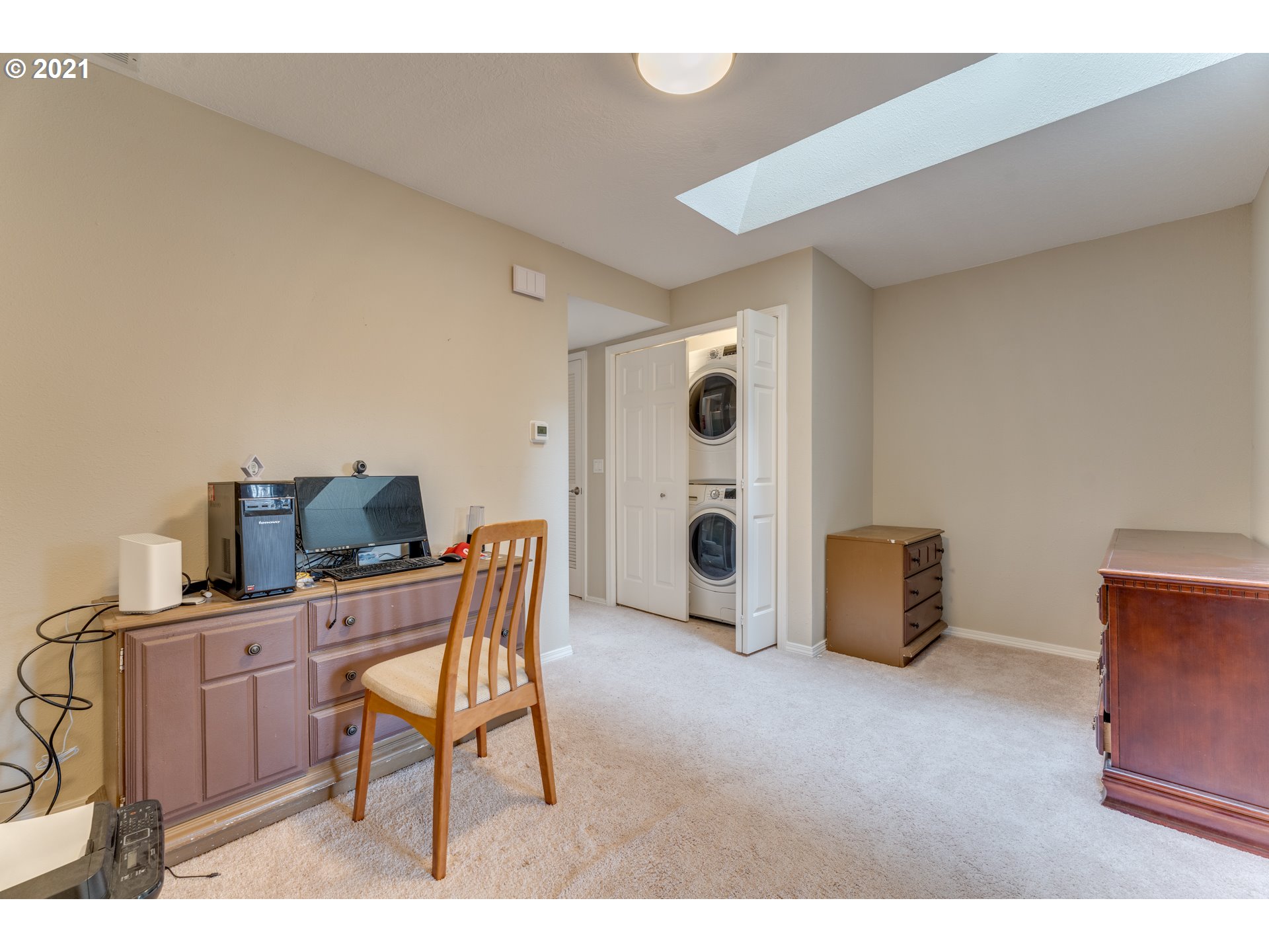 14134 East Burnside Street, Unit 4 Portland, OR 97233 - Photo 17 of 27 a living room with furniture and a flat screen tv