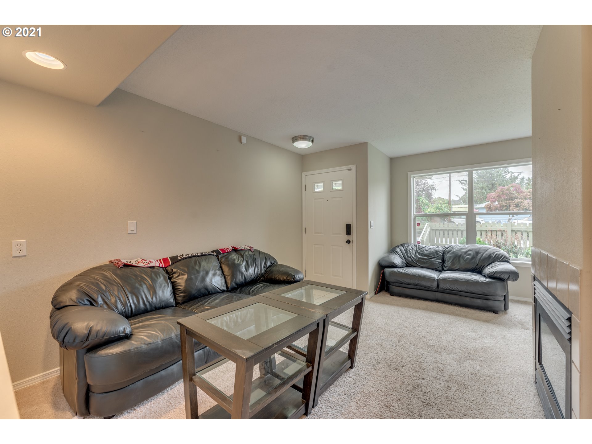 14134 East Burnside Street, Unit 4 Portland, OR 97233 - Photo 3 of 27 a living room with furniture and a couch