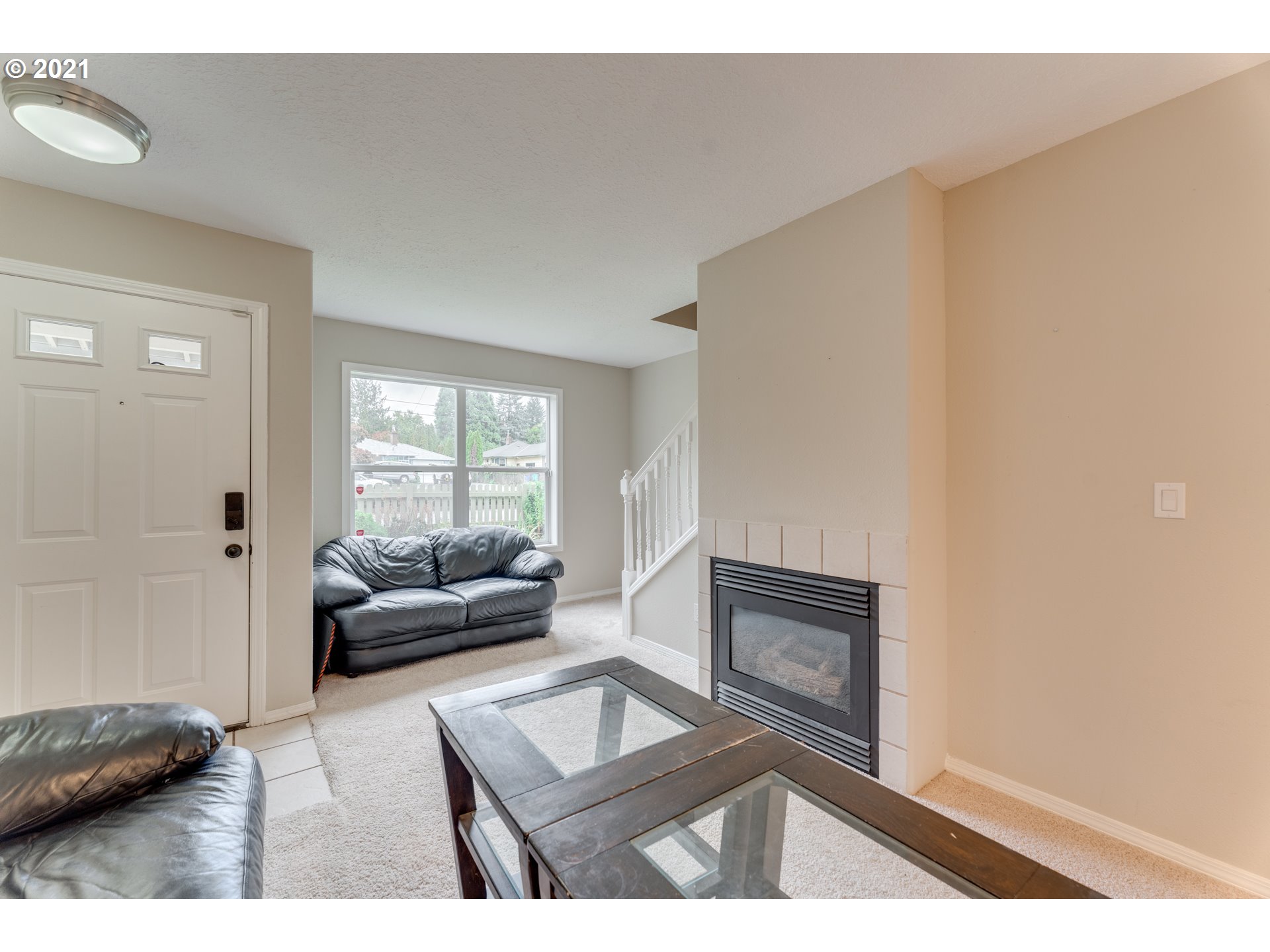 14134 East Burnside Street, Unit 4 Portland, OR 97233 - Photo 5 of 27 a living room with furniture and a window