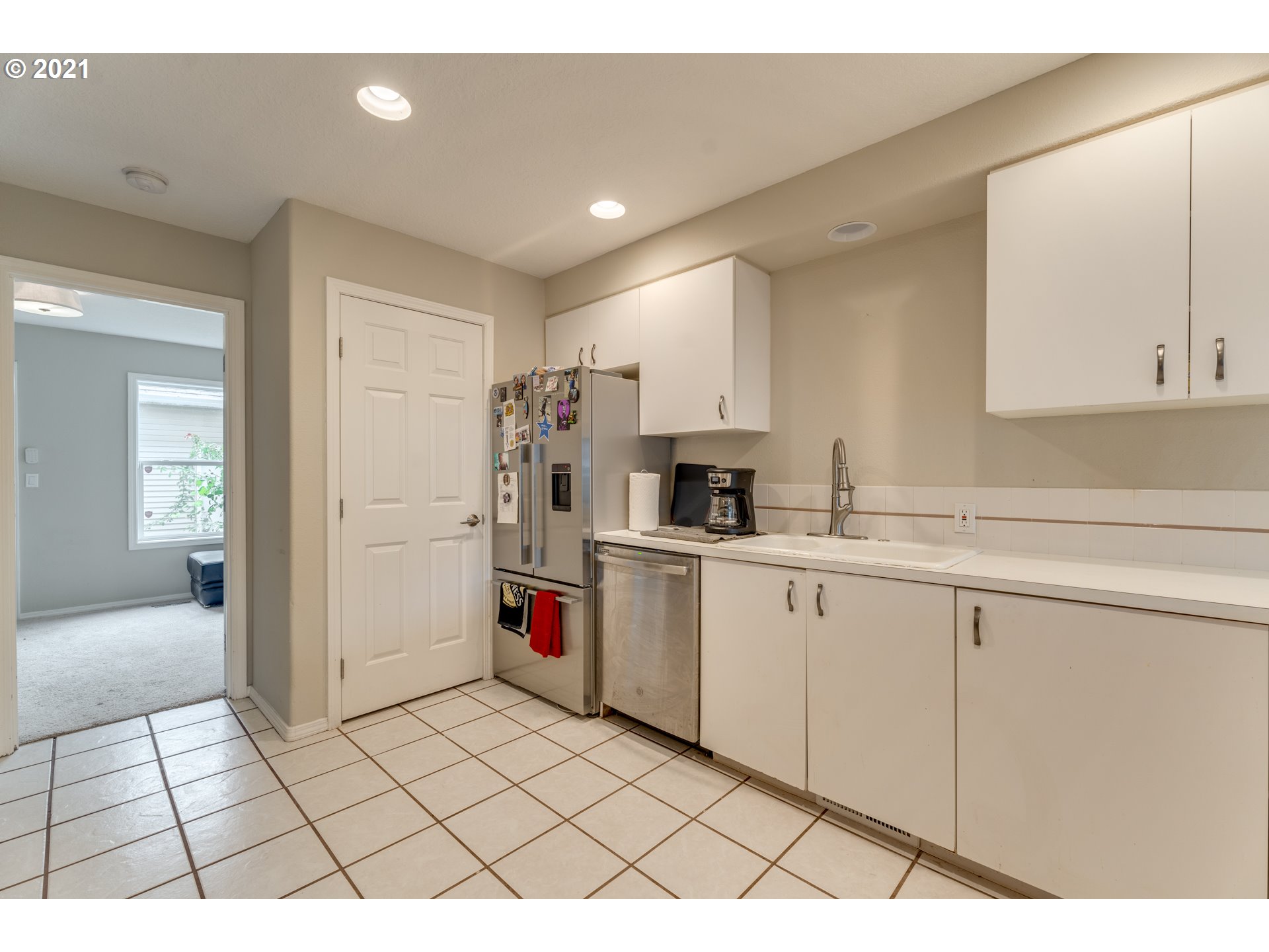 14134 East Burnside Street, Unit 4 Portland, OR 97233 - Photo 9 of 27 a kitchen with a sink and cabinets