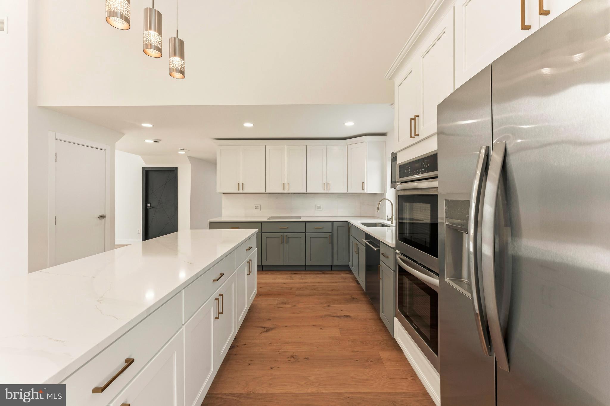 3750 Wheatsheaf Road Huntingdon Valley, PA 19006 - Photo 12 of 45 a large kitchen with a large counter top stainless steel appliances and cabinets