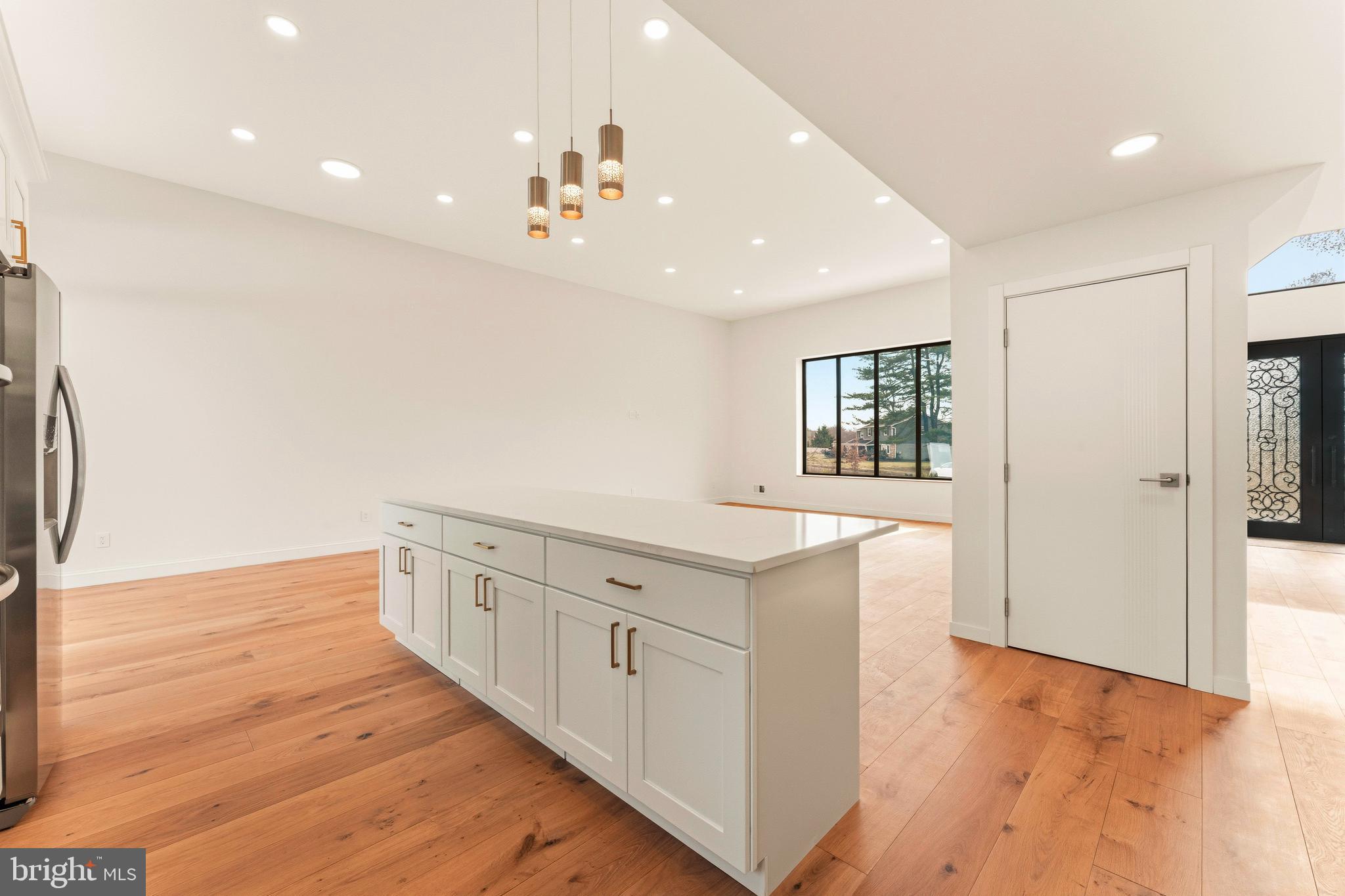 3750 Wheatsheaf Road Huntingdon Valley, PA 19006 - Photo 13 of 45 a view of a kitchen with kitchen island granite countertop cabinets and wooden floor