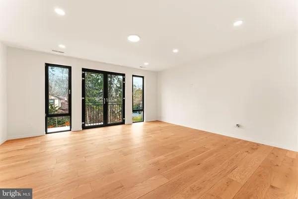 a view of an empty room with a sliding door