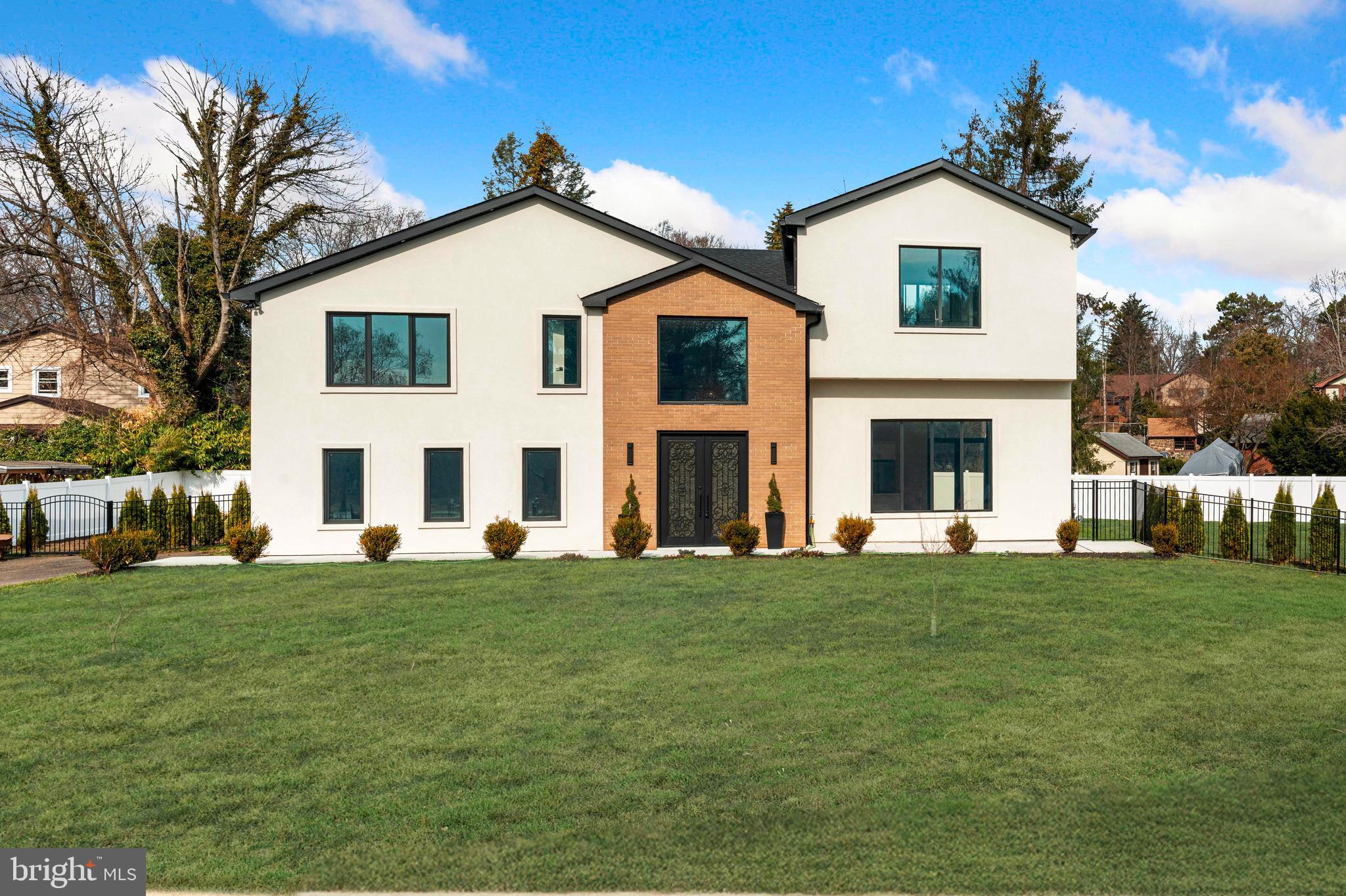 3750 Wheatsheaf Road Huntingdon Valley, PA 19006 - Photo 2 of 45 a view of a yard in front of a brick house with a big yard