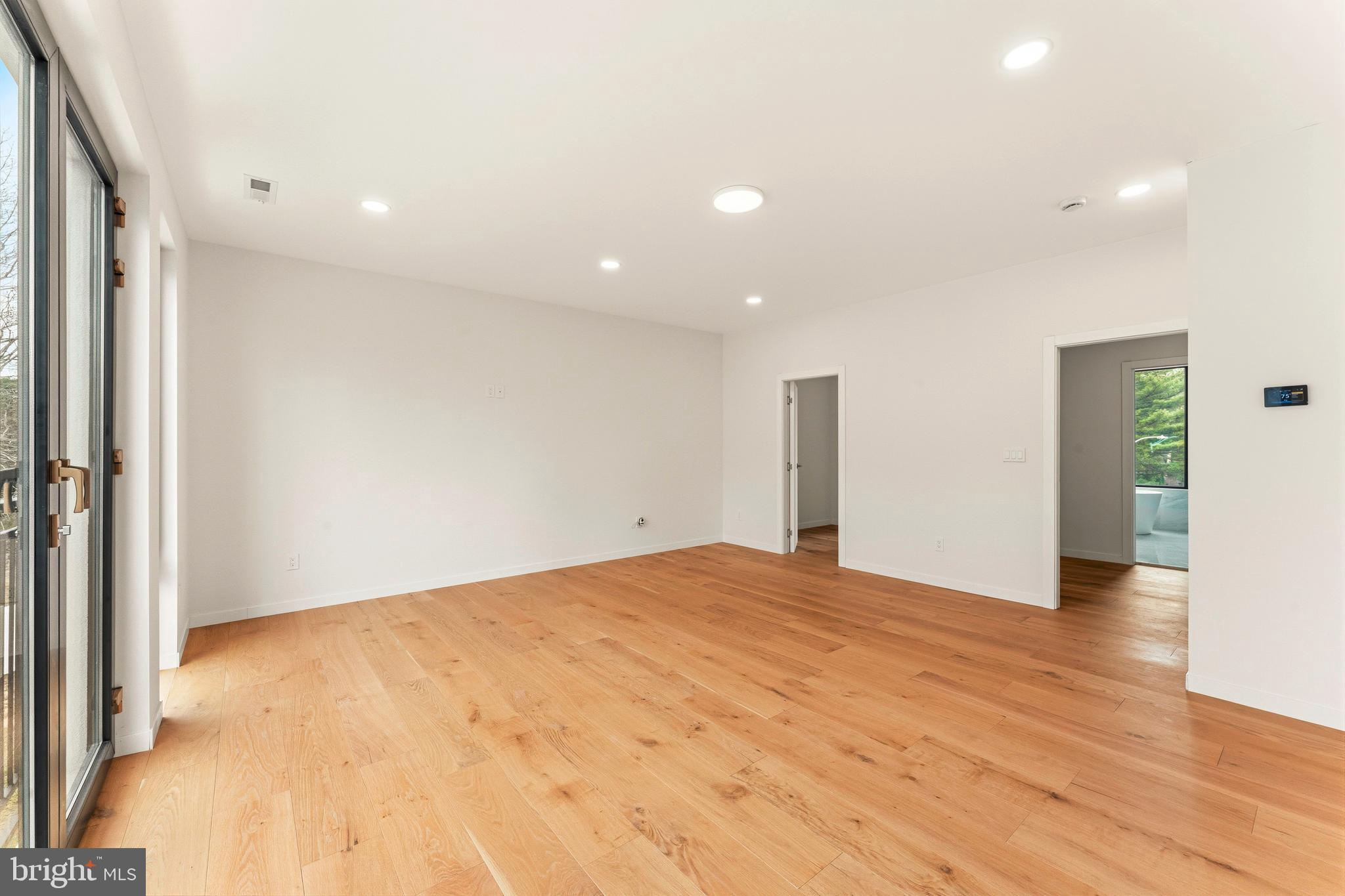 3750 Wheatsheaf Road Huntingdon Valley, PA 19006 - Photo 21 of 45 a view of an empty room with wooden floor and a window