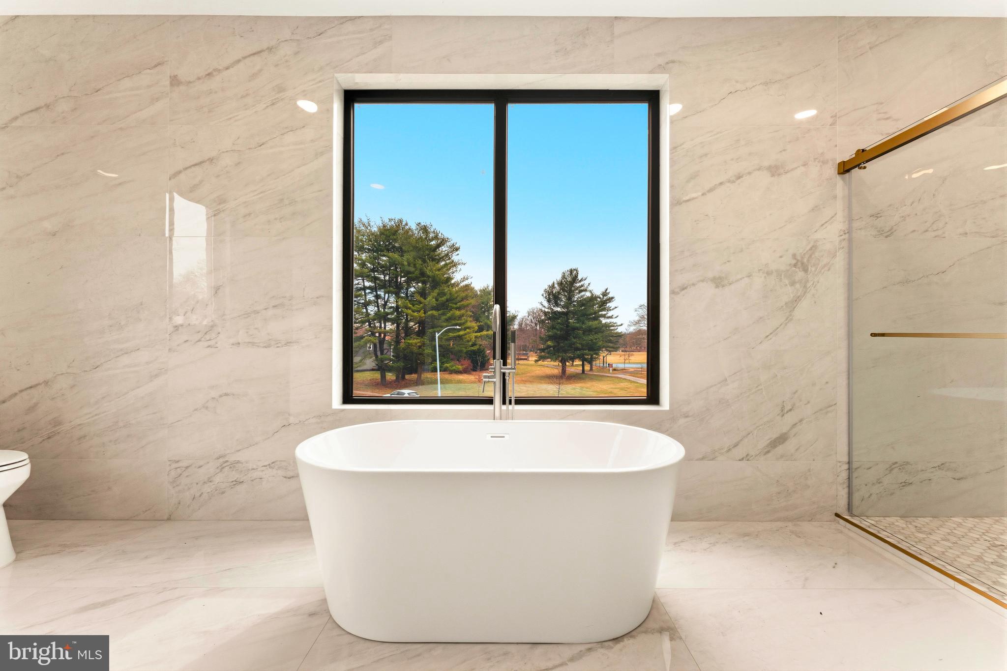 3750 Wheatsheaf Road Huntingdon Valley, PA 19006 - Photo 24 of 45 a white bath tub sitting in a bathroom