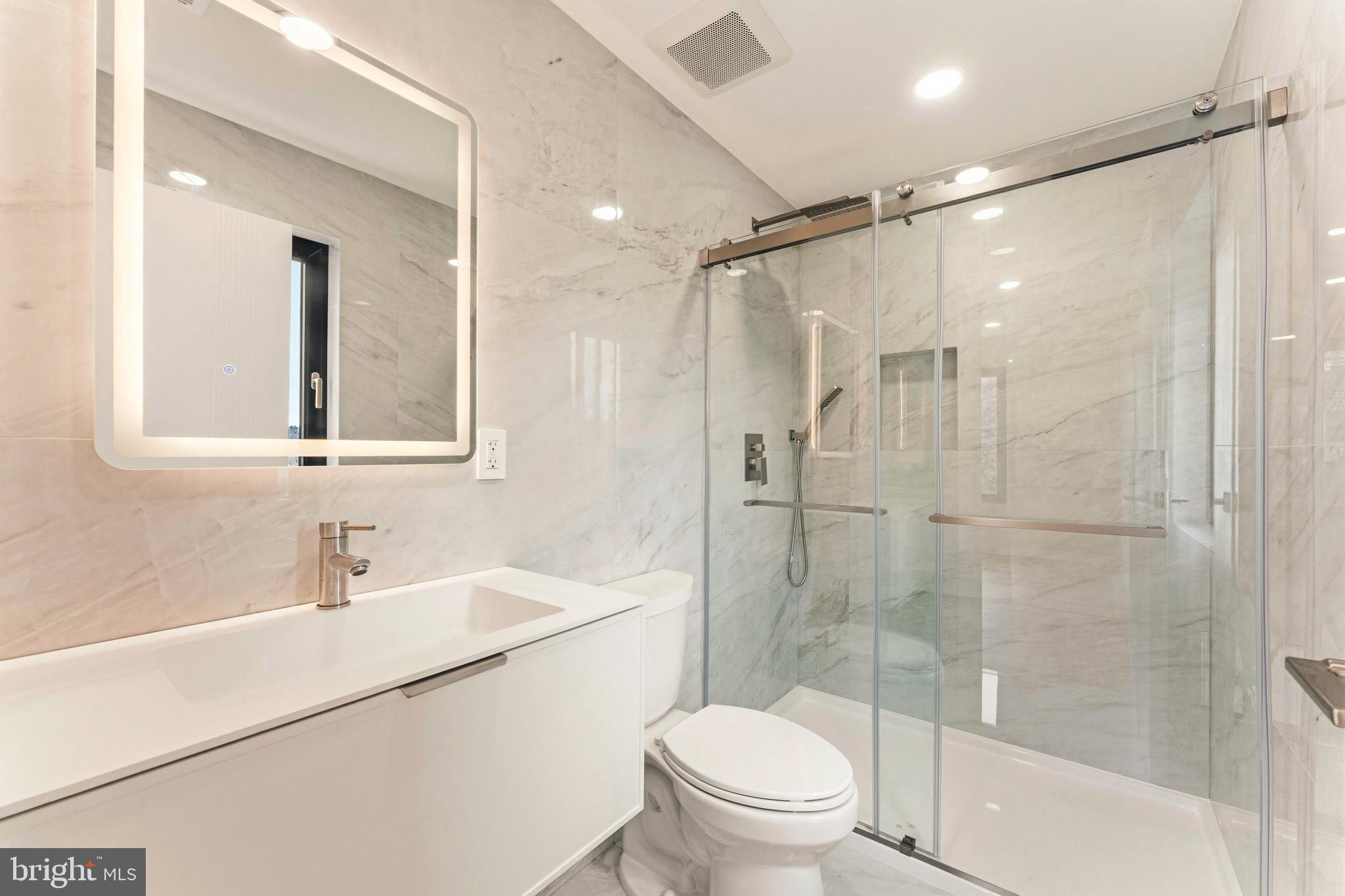 3750 Wheatsheaf Road Huntingdon Valley, PA 19006 - Photo 32 of 45 a bathroom with a shower sink vanity mirror and toilet