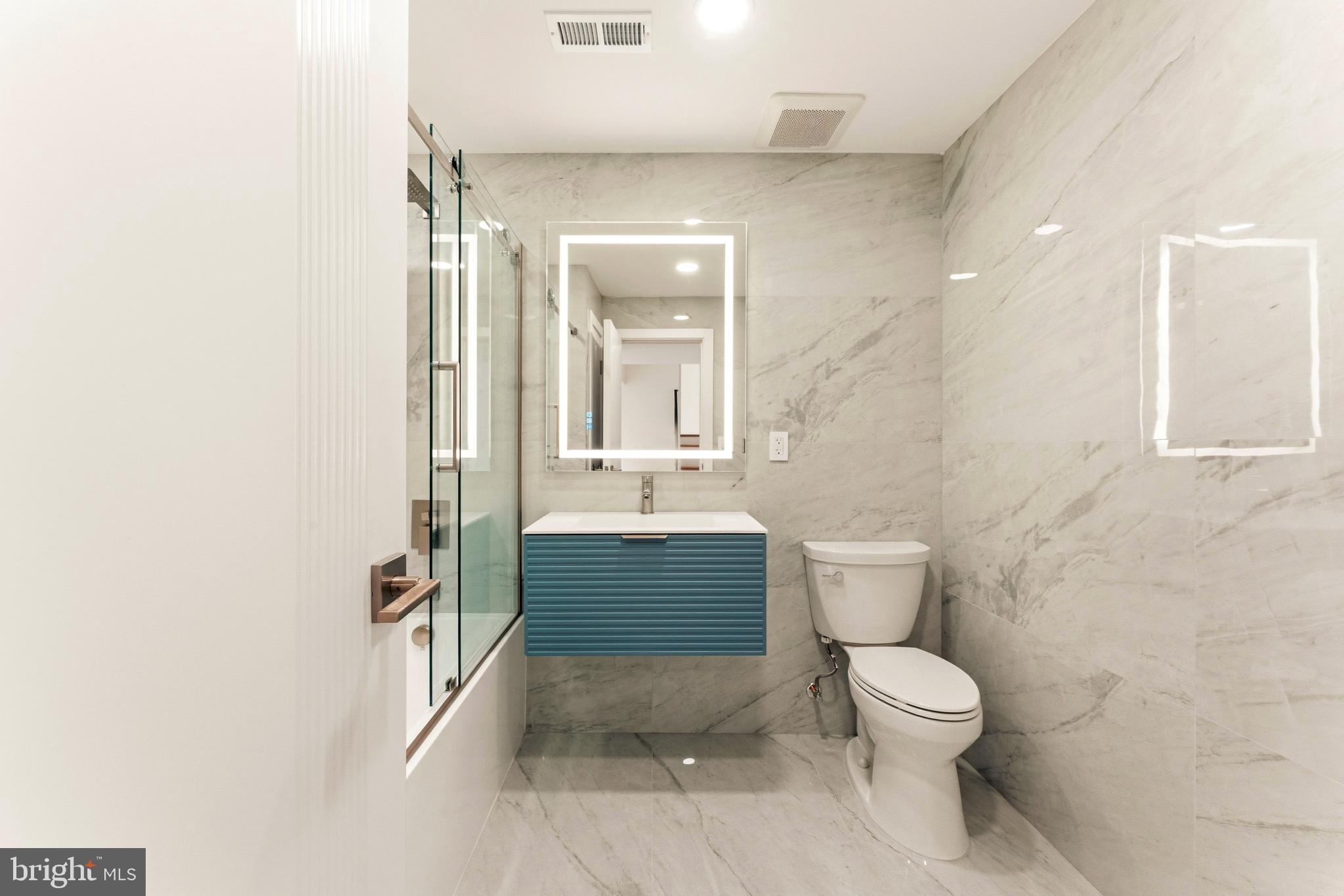 3750 Wheatsheaf Road Huntingdon Valley, PA 19006 - Photo 35 of 45 a bathroom with a toilet a sink and mirror